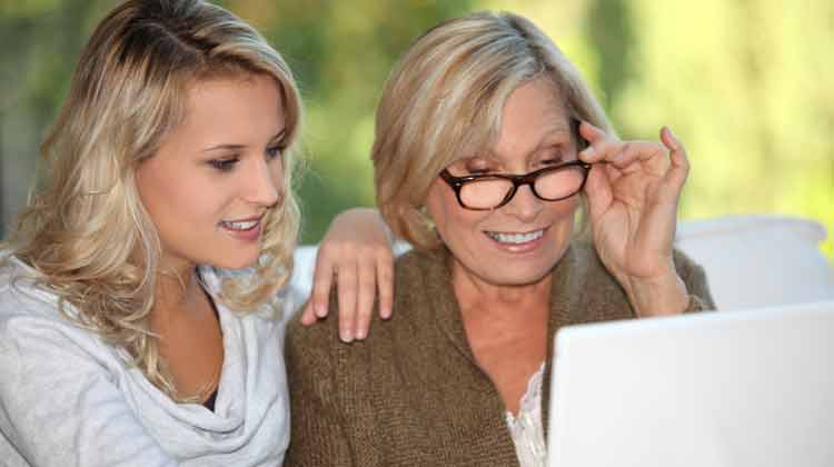 Mother and daughter looking at a computer screen